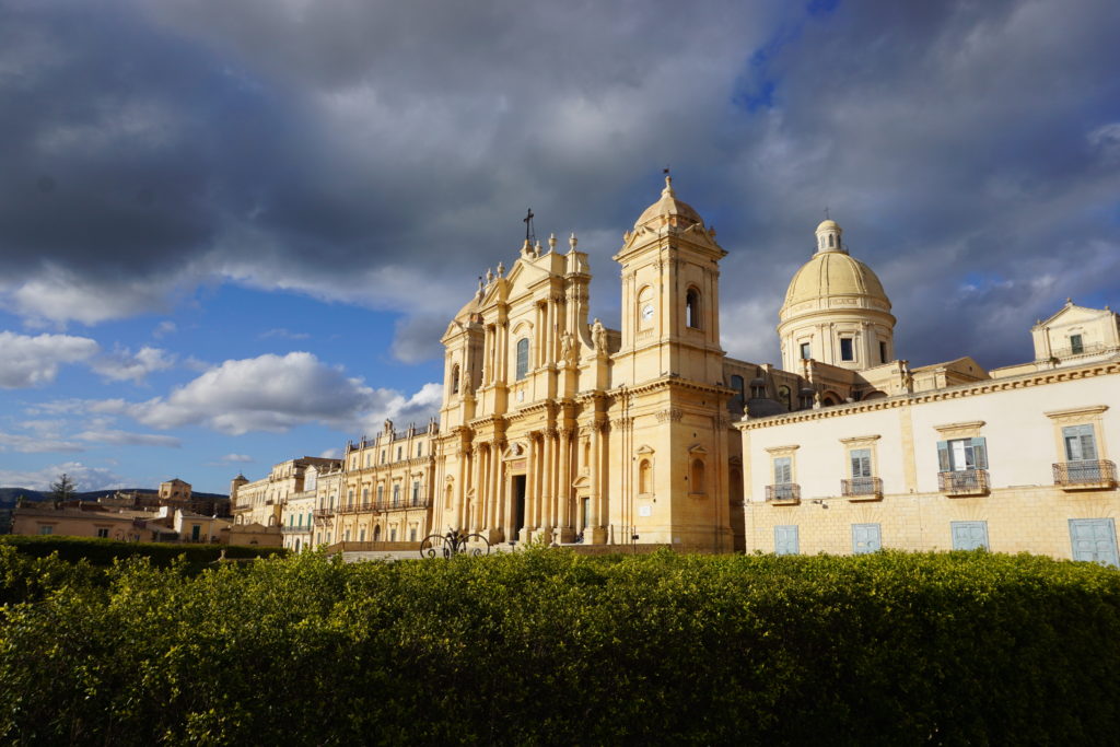 view of a building in Noto, Sicily, lit up golden by the sunlight