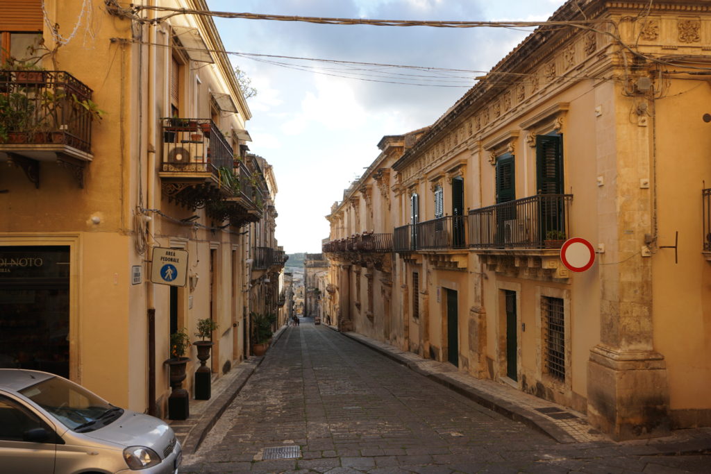 signs telling drivers in sicily not to enter down a pedestrian only road.