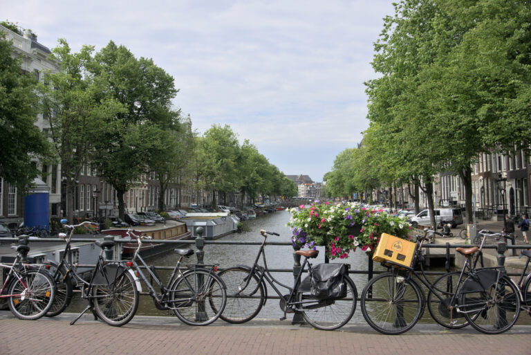 Boats along the canal as seen on our 4 days in Amsterdam with kids.