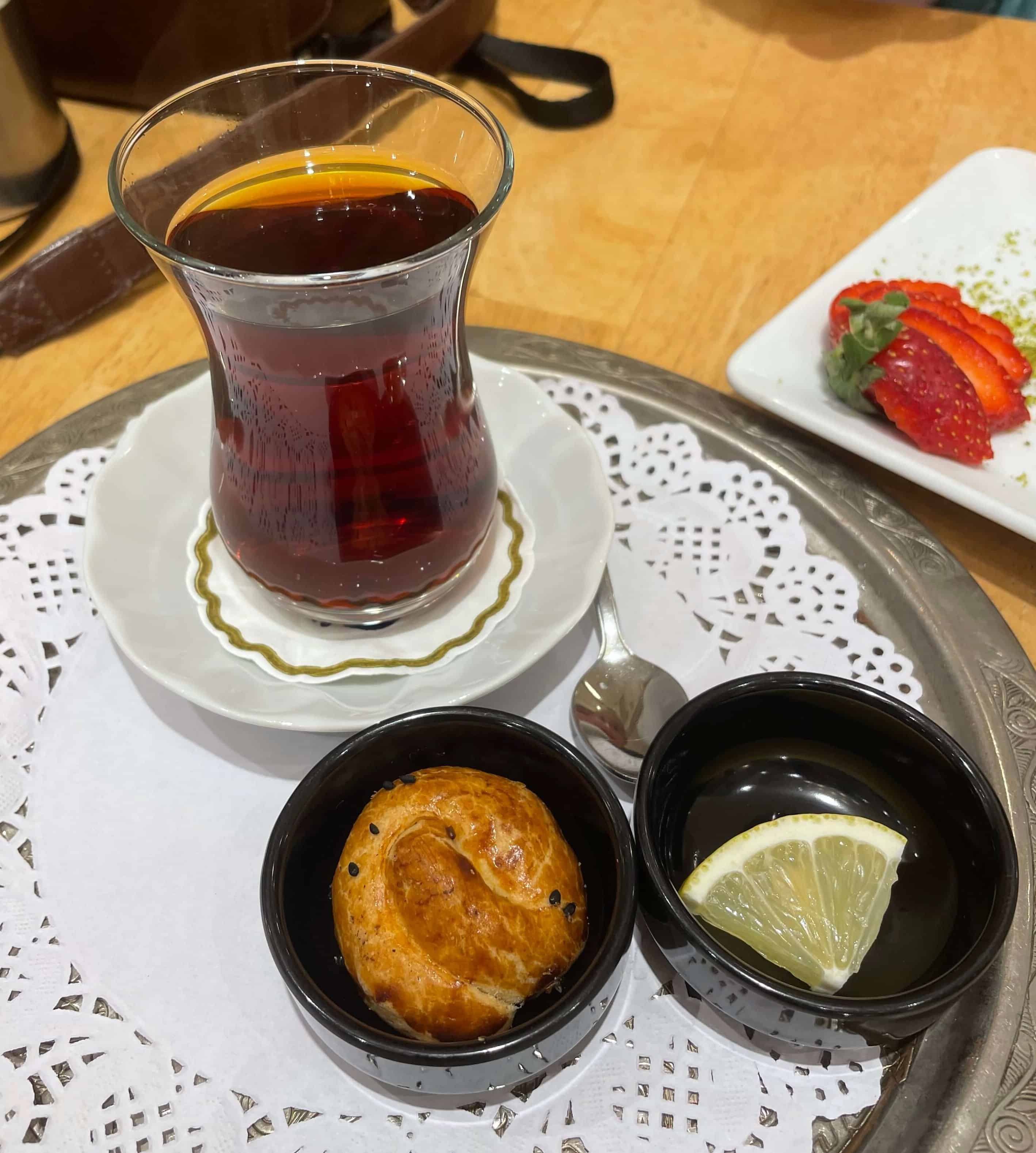 Tulip shaped glass full of Turkish black tea, the quintessential traditional Turkish drink.