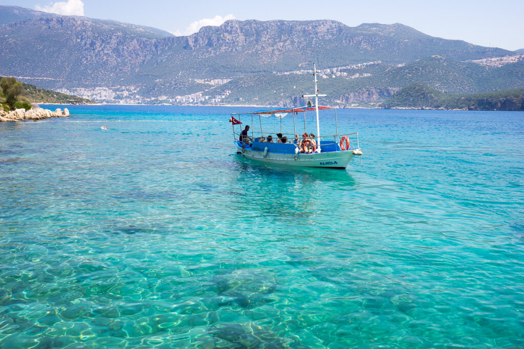 boat on clear ocean waters