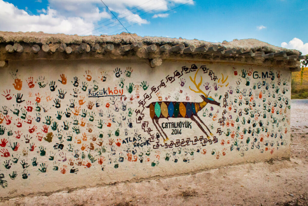 mud wall with paintings on it