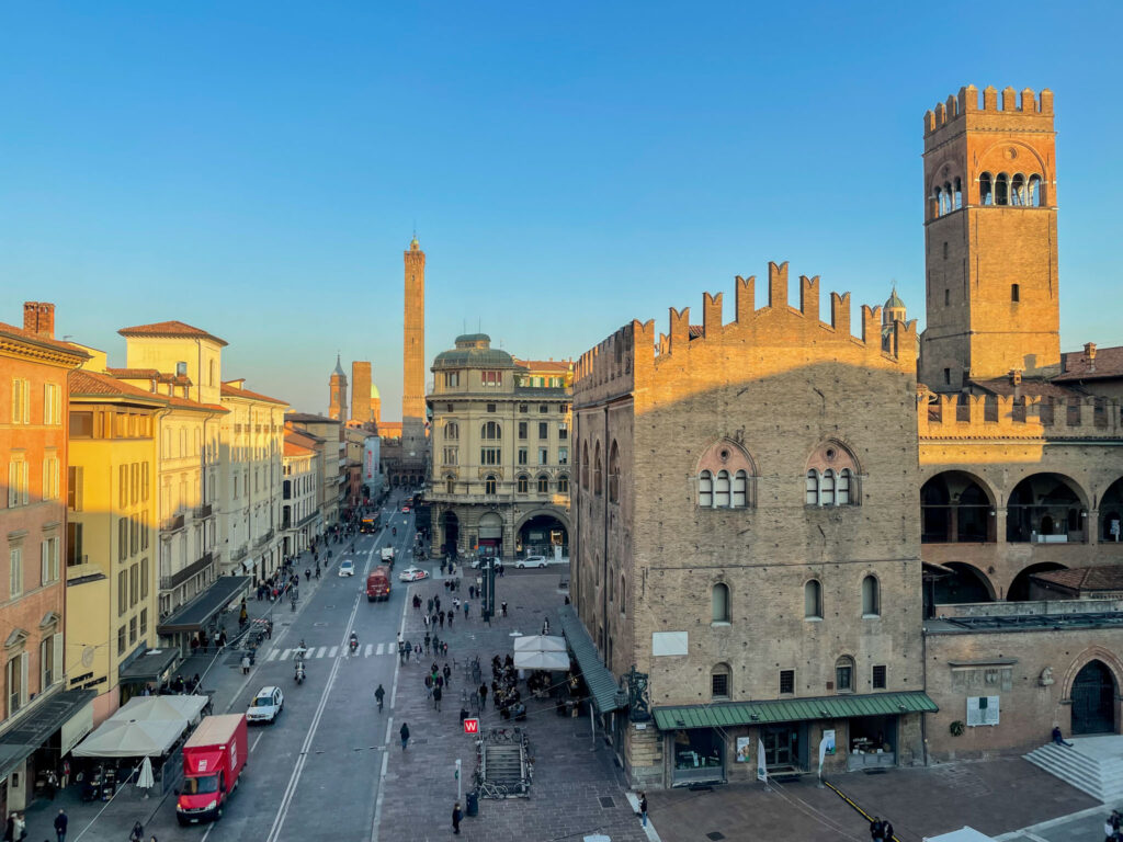 buildings in Bologna illuminated by the setting sun.