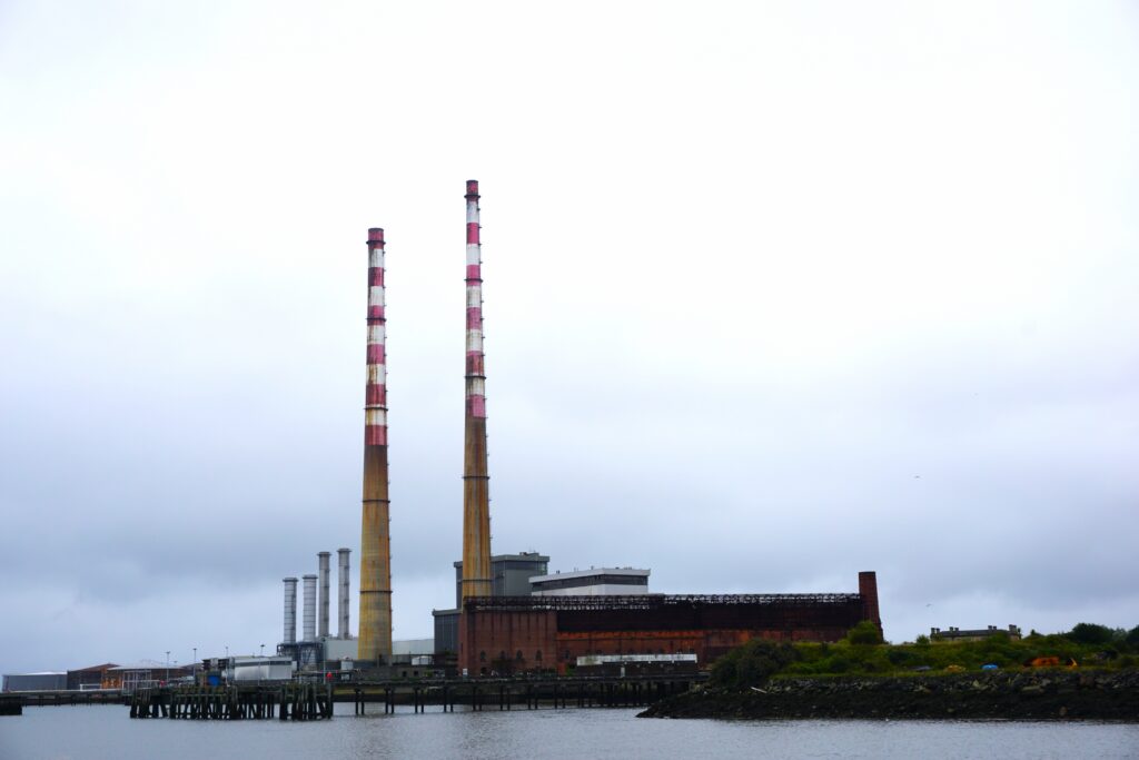 brown smokestacks with red and white stripes