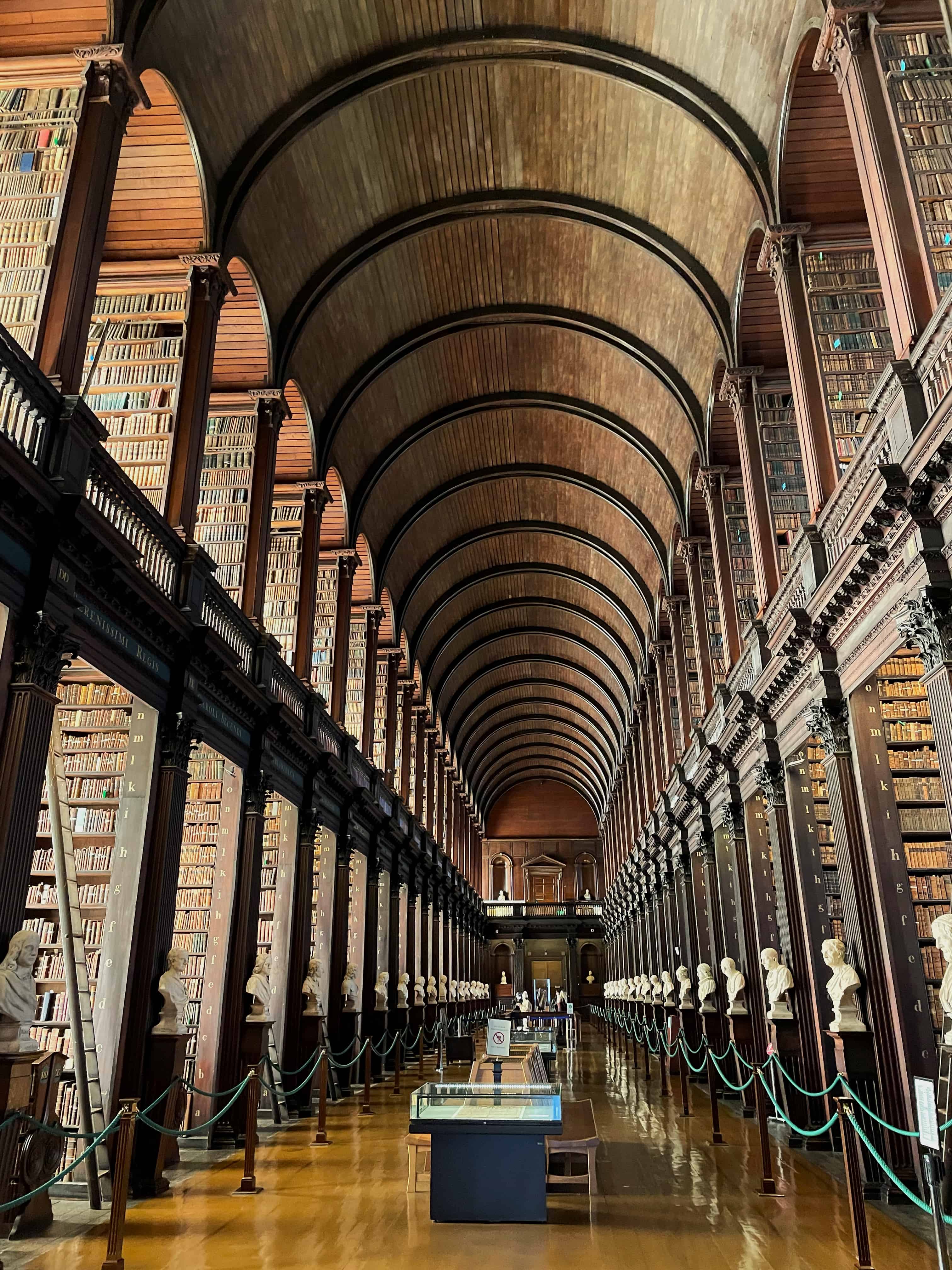 old wooden interior at Trinity Library, one of the best places to visit in dublin on a rainy day.