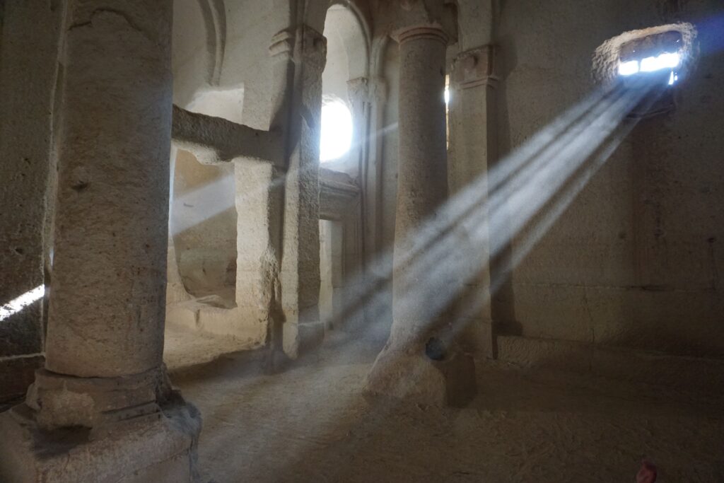 church cut into stone with light pouring in