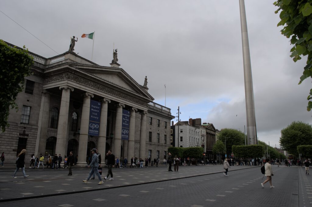 colonial building and large metal spire next to it