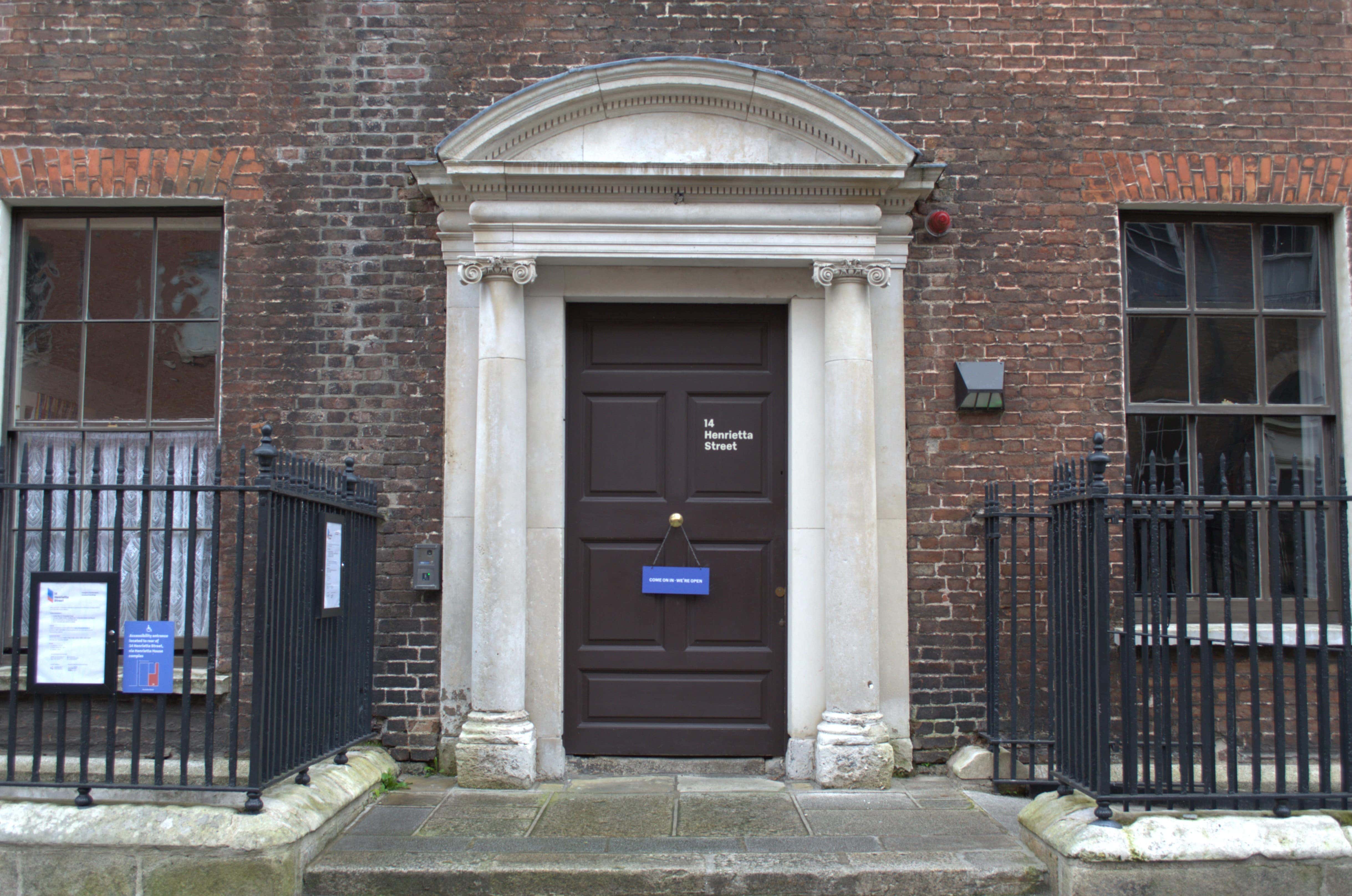 brown door in white archway