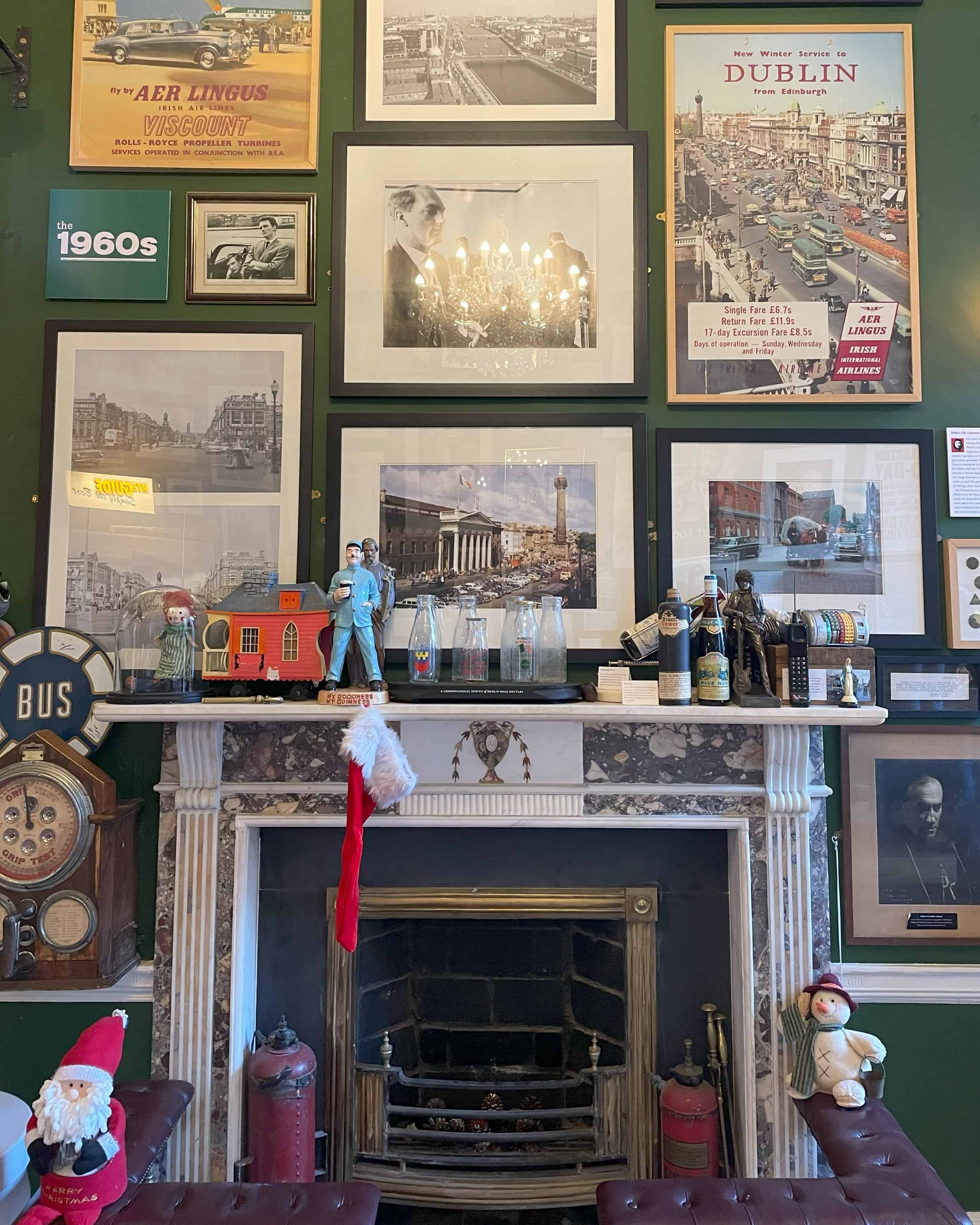 museum wall with framed photos.