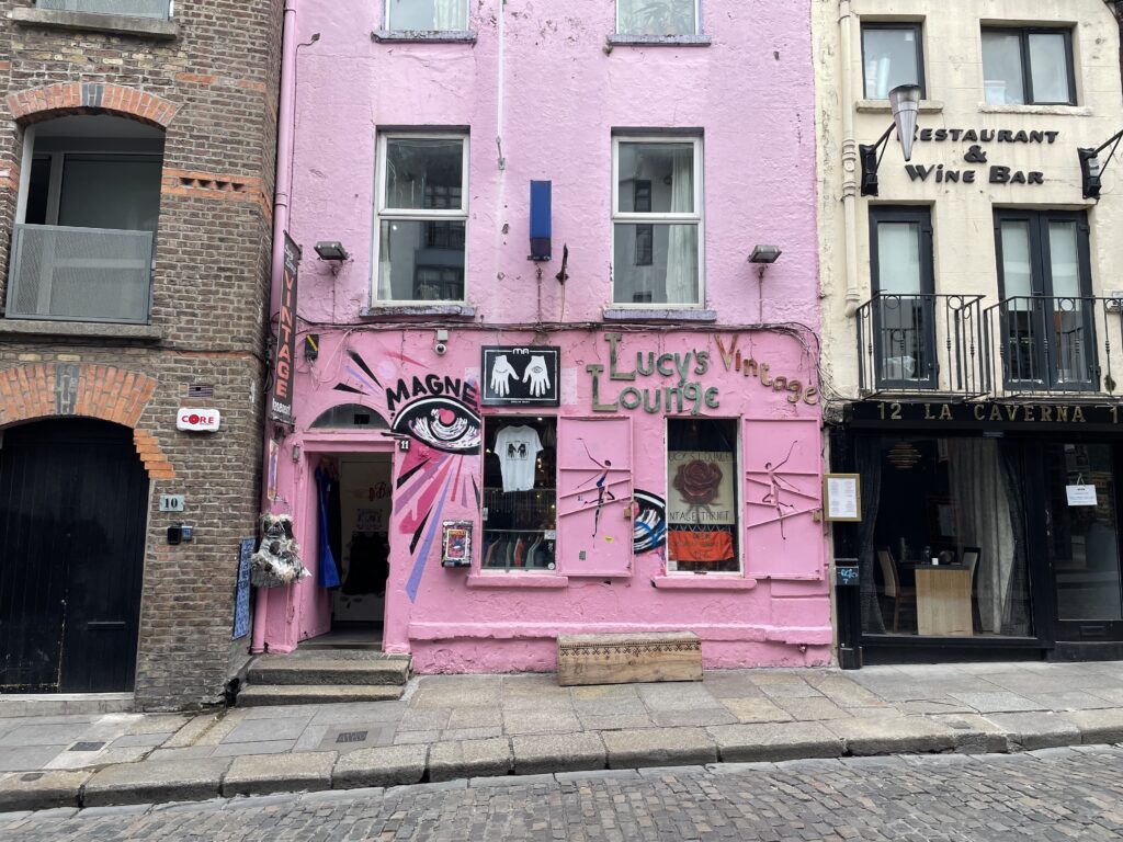 bright pink building with "lucy's lounge" written on it