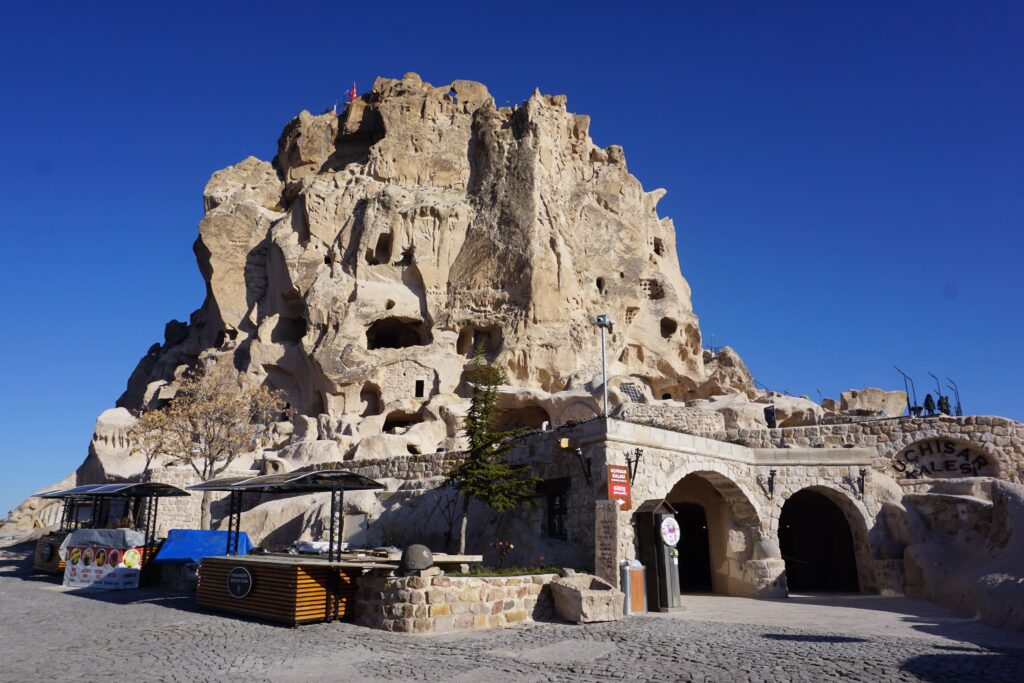 large rock outcropping with tunnels carved into it