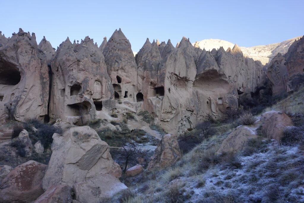 rock outcroppings with homes carved into them