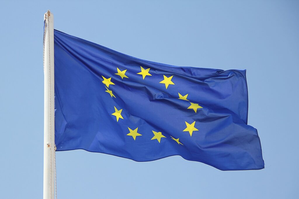 blue flag with circle of starts. The flag of the European Union.