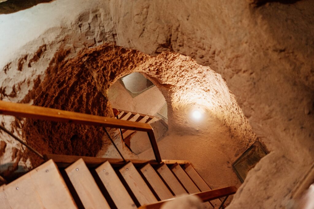 stairs descending into a tunnel in the underground city of Derinkuyu in Cappadocia, Turkey