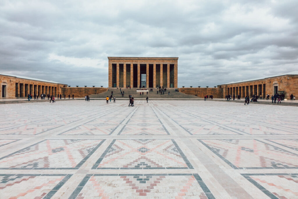 masoleum of brown stone builsings and large stone courtyard.