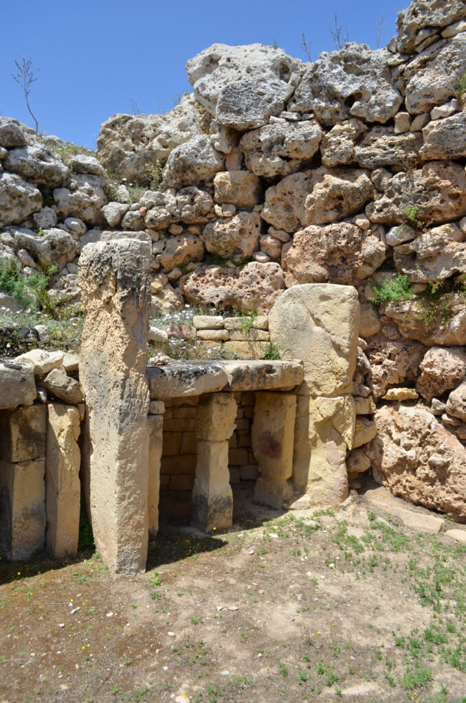 upright stones in potential altar formation at one of Malta's megalithic temples.