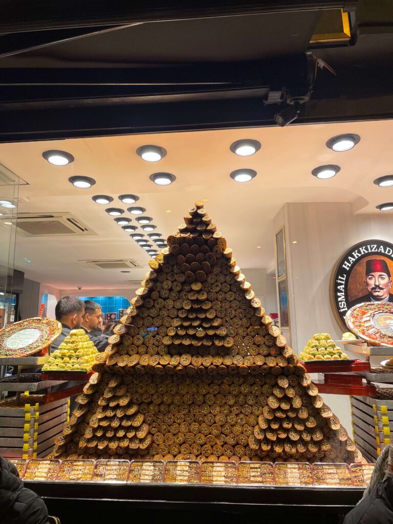 triangular tower of baklava in a shop window